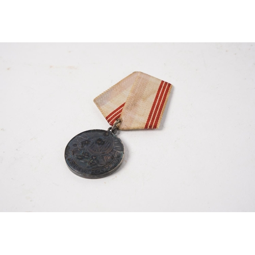 684 - A Russian/ USSR Veteran of Labour Medal.