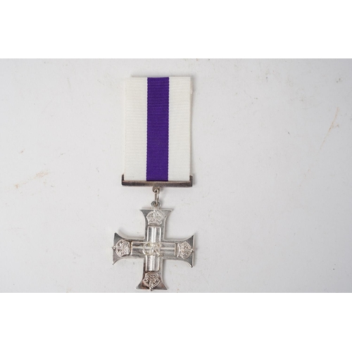 708 - A reproduction Military Cross medal.