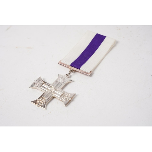 708 - A reproduction Military Cross medal.