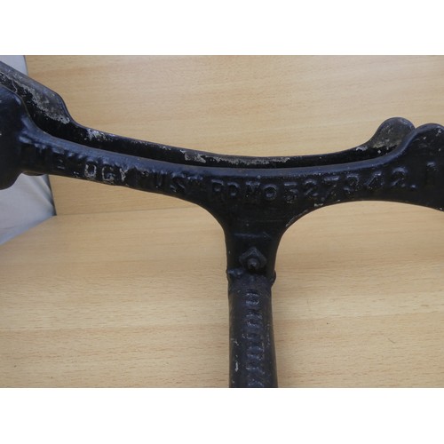 578 - A stunning antique cast iron bicycle stand, inscribed, 