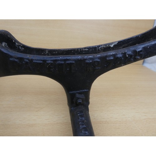 578 - A stunning antique cast iron bicycle stand, inscribed, 