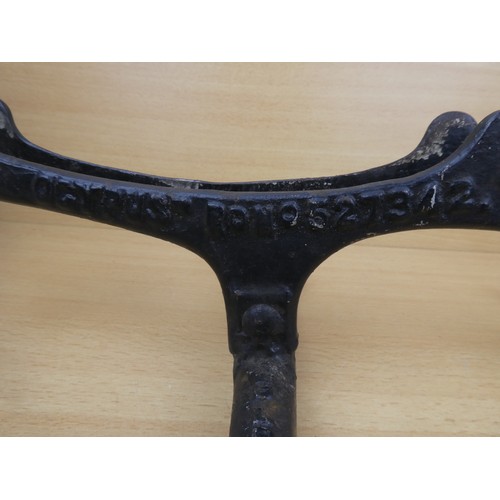 578 - A stunning antique cast iron bicycle stand, inscribed, 