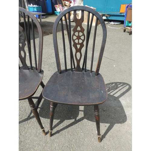 785 - A pair of Vintage stained wooden dining chairs.