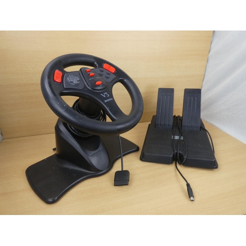 18 - A Playstation V3 Interact steering wheel and pedal set.