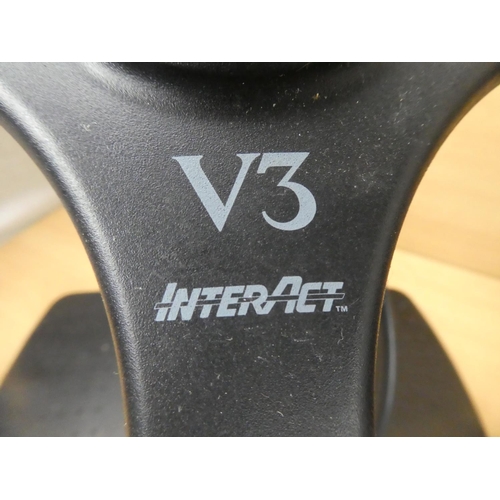 18 - A Playstation V3 Interact steering wheel and pedal set.