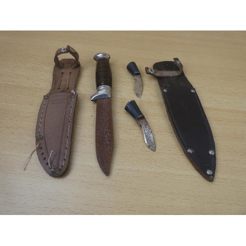 31 - A metal dagger and sheath and two miniature knives and sheath.