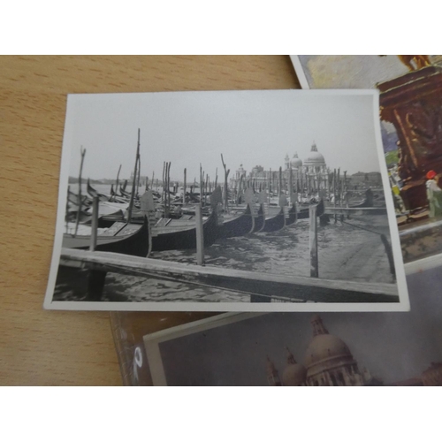 38 - A collection of vintage photographs and postcards.