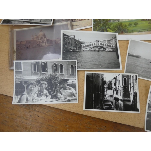 38 - A collection of vintage photographs and postcards.