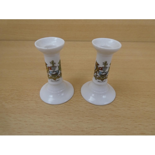 4 - A pair of Goss china candlesticks with the Belfast crest.