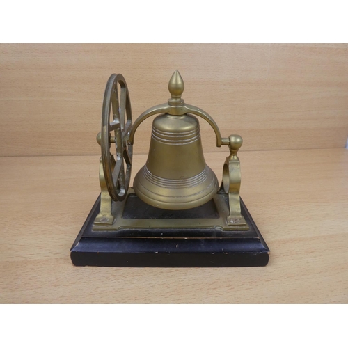 71 - A vintage brass mounted bell on stand.