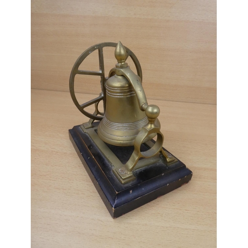 71 - A vintage brass mounted bell on stand.