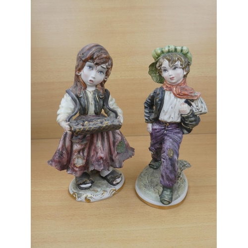 72 - A pair of Capodimonte style figures, each measuring 30cm in height.