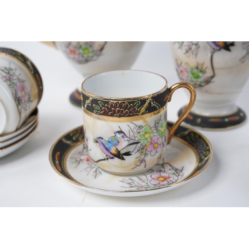 19 - An Oriental patterned coffee set with repairs to the milk jug.