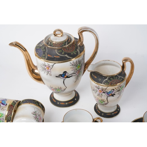 19 - An Oriental patterned coffee set with repairs to the milk jug.