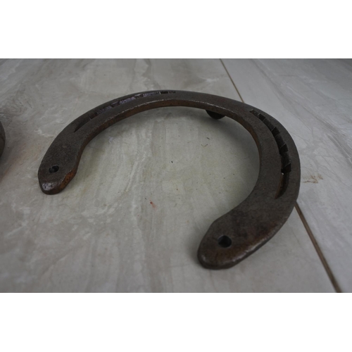 181 - Two antique horseshoes.