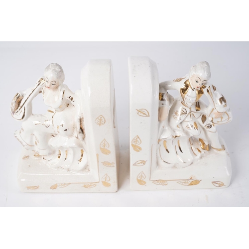 202 - A pair of ceramic bookends, Approx 16cm in height.