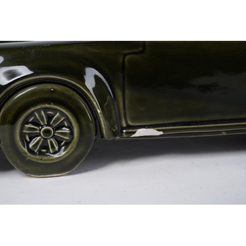 222 - A large ceramic model of a Porsche (A/F), Approx 36x15x12cm.