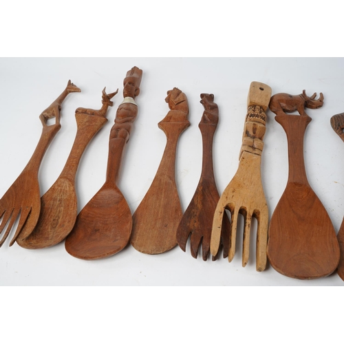 366 - A large lot of vintage animal and figurine wooden forks and spoons.