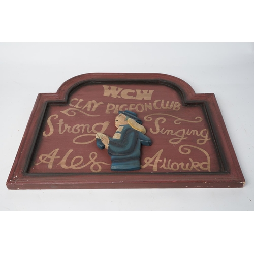 379 - An antique style wooden plaque for 'W.C.W Clay Pigeon Club', measuring 45cm x 37cm.