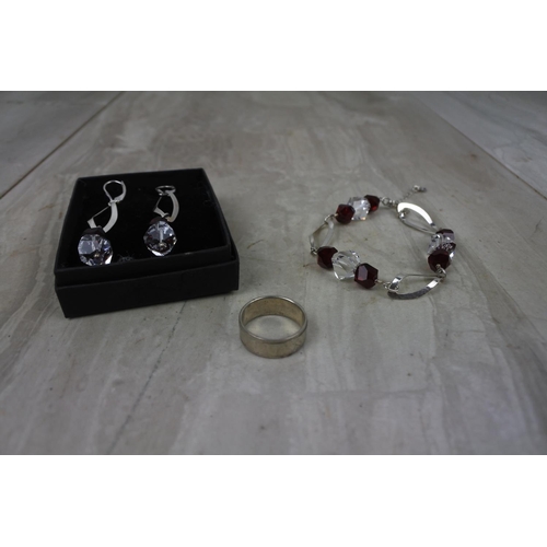 440 - A Sterling Silver ring and a matching earring and bracelet set.