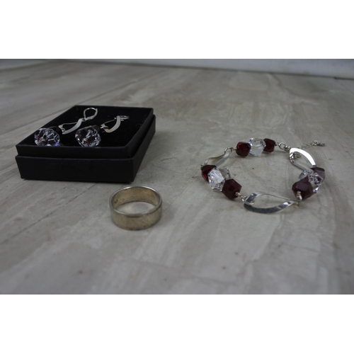 440 - A Sterling Silver ring and a matching earring and bracelet set.