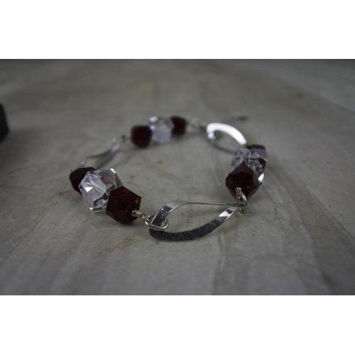 440 - A Sterling Silver ring and a matching earring and bracelet set.