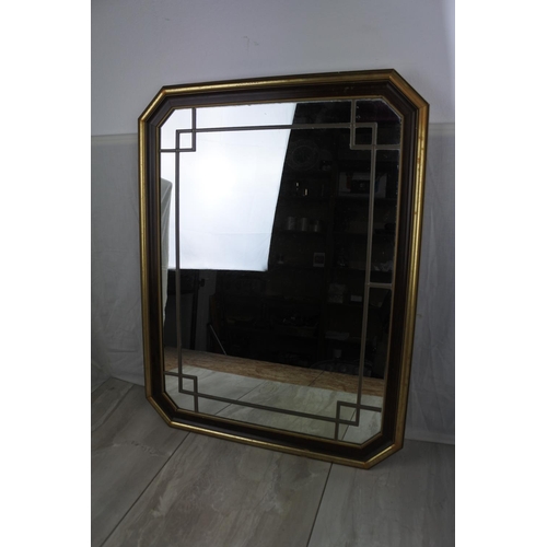 461 - A framed wall mirror with lead design, measuring 53cm x 68cm.