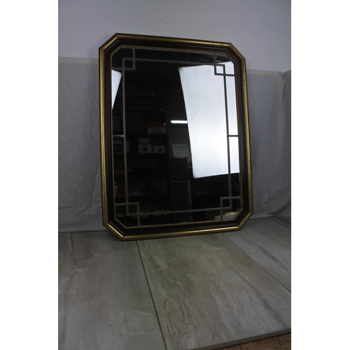 461 - A framed wall mirror with lead design, measuring 53cm x 68cm.