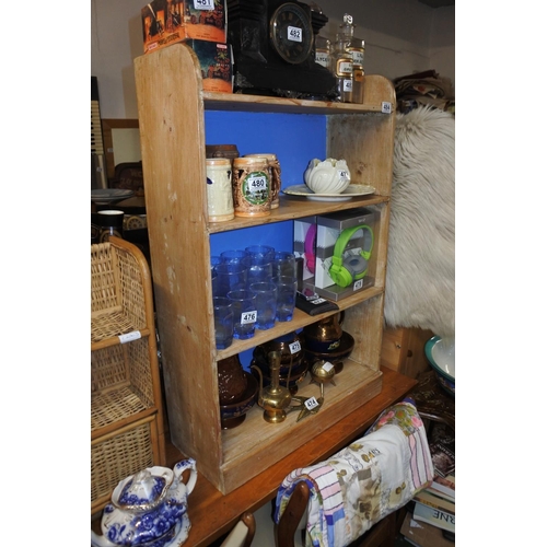 484 - A set of pine bookshelves with painted back panel.