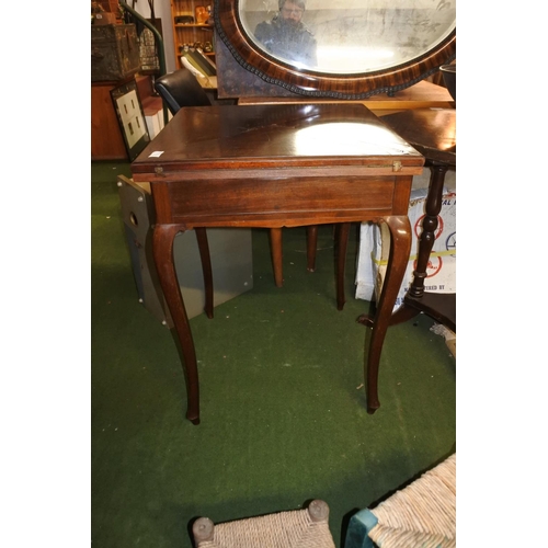 492 - An antique mahogany envelope card table, measuring 54cm x 54cm x 75cm.