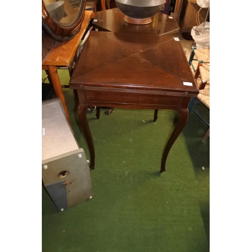 492 - An antique mahogany envelope card table, measuring 54cm x 54cm x 75cm.