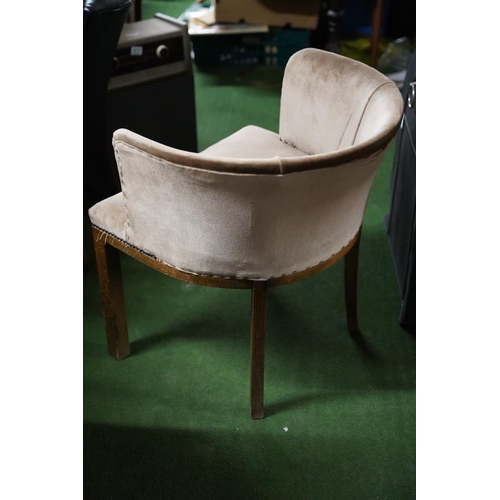 520 - An upholstered tub style chair.