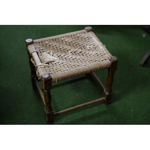 568 - An antique framed stool with weaved top.