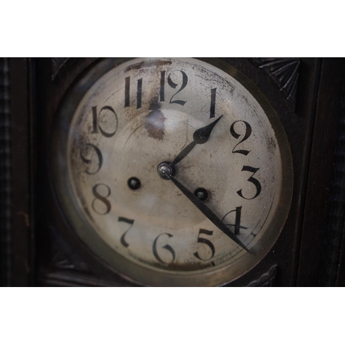 570 - A stunning antique German box clock with a floral panel.