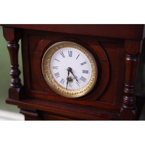 571 - A mahogany cased wall clock.