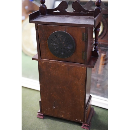 571 - A mahogany cased wall clock.