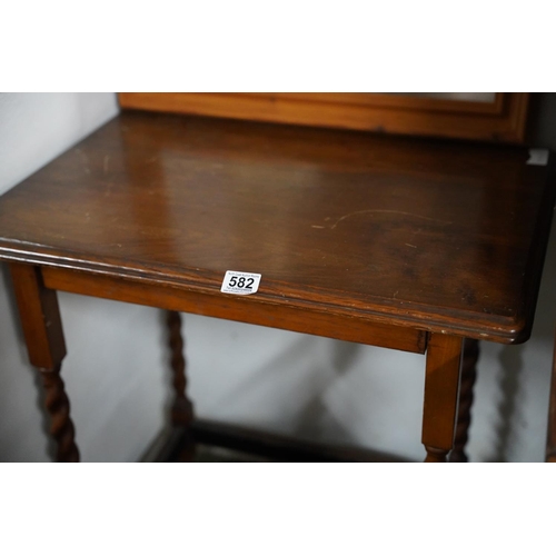 582 - An oak occasional table with barley twist detail.