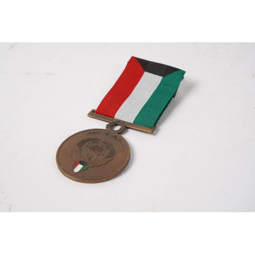 679 - A Kuwait Liberation Medal.