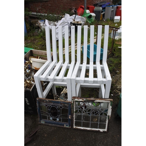 734 - A pair of painted wooden garden chairs.