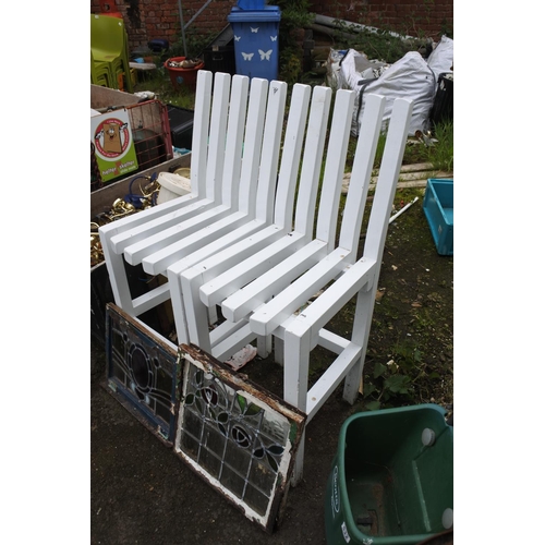 734 - A pair of painted wooden garden chairs.