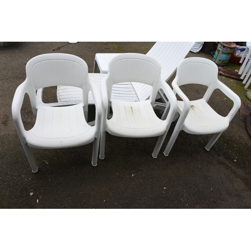 756 - A set of three plastic garden chairs.