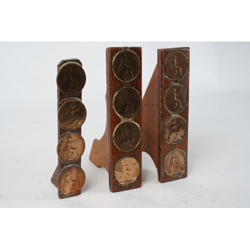 880 - A lot of antique One penny coins set in wooden stands.