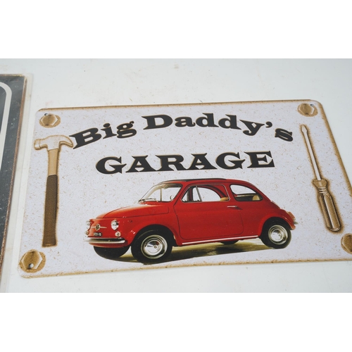 1021 - A Big Daddy's Garage metal sign and another.