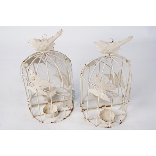 1026 - A pair of metal cage candleholders decorated with butterflies.