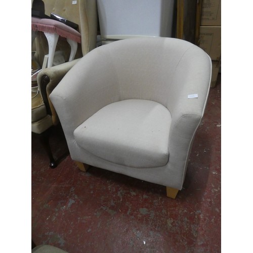 1123 - An upholstered modern tub chair.