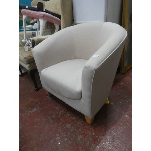 1123 - An upholstered modern tub chair.