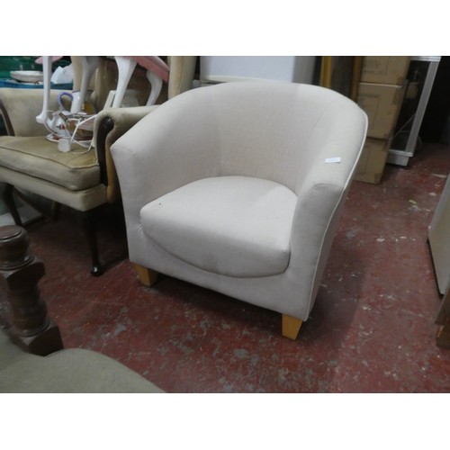 1123 - An upholstered modern tub chair.