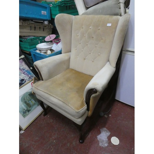 1129 - An Stunning Upholstered winged backed Armchair.