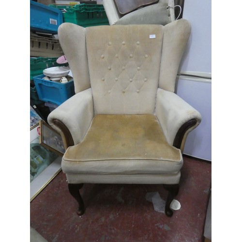 1129 - An Stunning Upholstered winged backed Armchair.