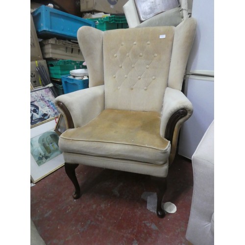 1129 - An Stunning Upholstered winged backed Armchair.